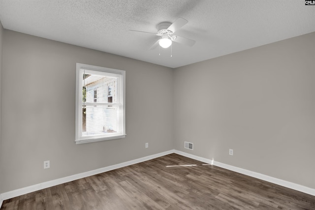 220 Colchester Dr, Columbia, SC 29223 - empty room featuring a ceiling fan, dark wood-type flooring, a textured ceiling, and baseboards