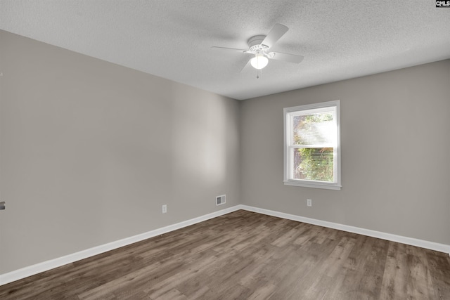 220 Colchester Dr, Columbia, SC 29223 - unfurnished room featuring dark wood-type flooring, a textured ceiling, a ceiling fan, and baseboards