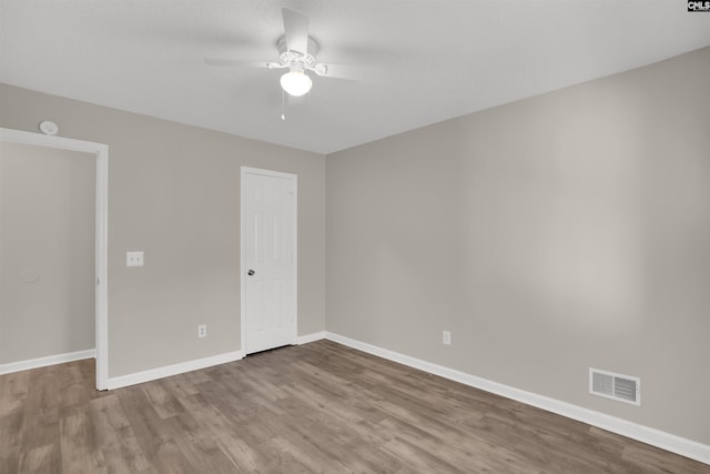 220 Colchester Dr, Columbia, SC 29223 - unfurnished bedroom featuring wood finished floors, baseboards, and ceiling fan