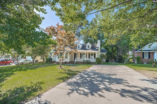 220 Colchester Dr, Columbia, SC 29223 - cape cod home with covered porch, a chimney, a front lawn, and concrete driveway