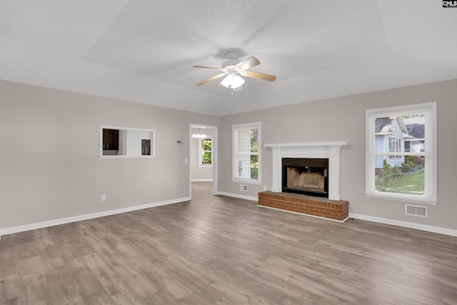 220 Colchester Dr, Columbia, SC 29223 - unfurnished living room with wood finished floors, a ceiling fan, baseboards, and a fireplace