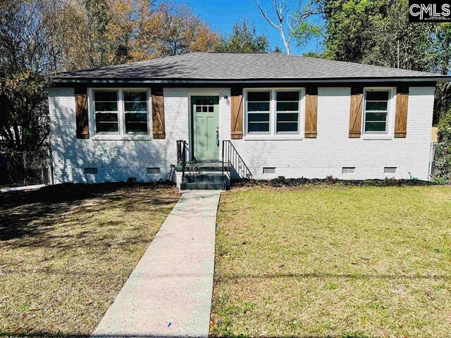 4101 Ridgewood Ave, Columbia, SC 29203 - view of front of house with crawl space, brick siding, a front yard, and roof with shingles