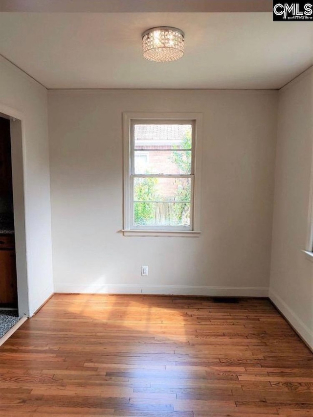 4101 Ridgewood Ave, Columbia, SC 29203 - spare room with wood finished floors and baseboards