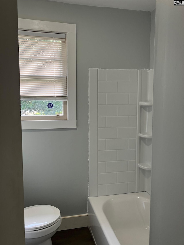 4101 Ridgewood Ave, Columbia, SC 29203 - bathroom with toilet, baseboards, and bathtub / shower combination