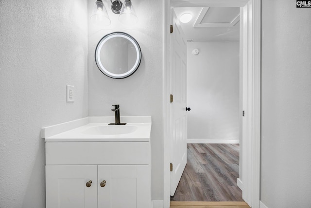 3509 Baywater Dr, Columbia, SC 29209 - bathroom with vanity, wood finished floors, a textured wall, and baseboards