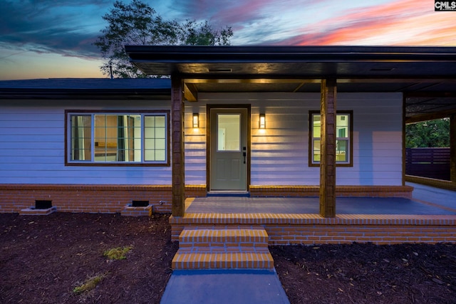3509 Baywater Dr, Columbia, SC 29209 - exterior entry at dusk with covered porch and crawl space