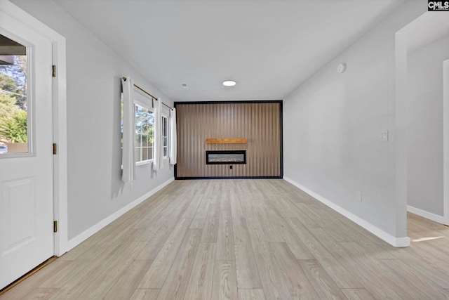 3509 Baywater Dr, Columbia, SC 29209 - unfurnished living room with a glass covered fireplace, baseboards, light wood-style flooring, and recessed lighting