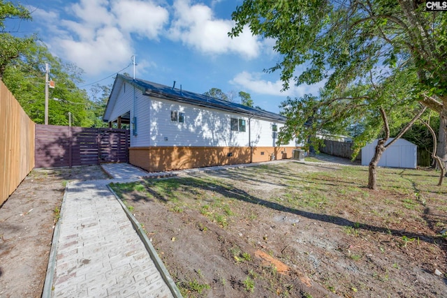 3509 Baywater Dr, Columbia, SC 29209 - rear view of house featuring a fenced backyard, central AC, and brick siding
