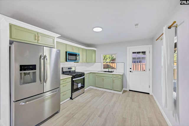 3509 Baywater Dr, Columbia, SC 29209 - kitchen with green cabinets, appliances with stainless steel finishes, light countertops, and a sink