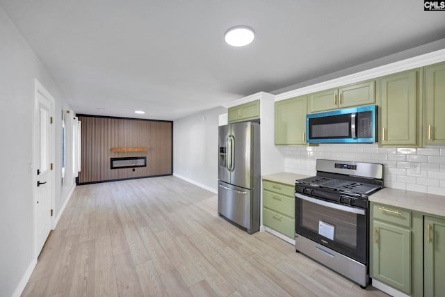 3509 Baywater Dr, Columbia, SC 29209 - kitchen featuring green cabinets, appliances with stainless steel finishes, baseboards, light countertops, and tasteful backsplash