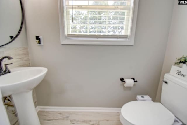 113 Dutch Oaks Dr, Irmo, SC 29063 - bathroom with toilet, a sink, and baseboards