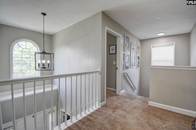 113 Dutch Oaks Dr, Irmo, SC 29063 - corridor with an upstairs landing, carpet floors, a chandelier, and baseboards