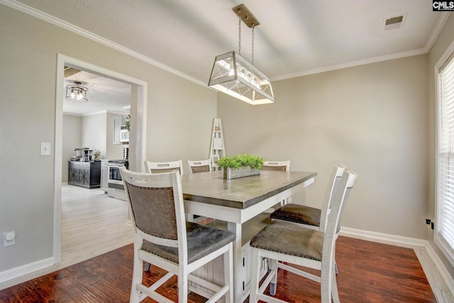 113 Dutch Oaks Dr, Irmo, SC 29063 - dining room with wood finished floors, crown molding, baseboards, and healthy amount of natural light