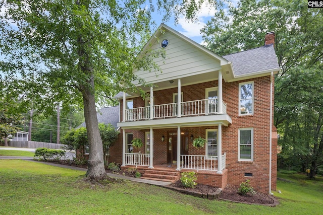 101 Stephenson Ln, Columbia, SC 29212 - view of front of home featuring a balcony, covered porch, roof with shingles, a front lawn, and a chimney