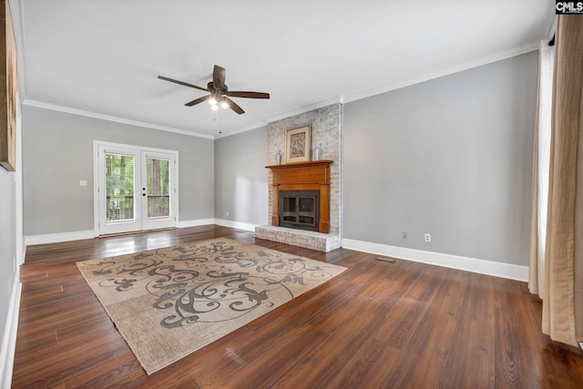 101 Stephenson Ln, Columbia, SC 29212 - unfurnished living room featuring a ceiling fan, baseboards, crown molding, dark wood-style floors, and a fireplace