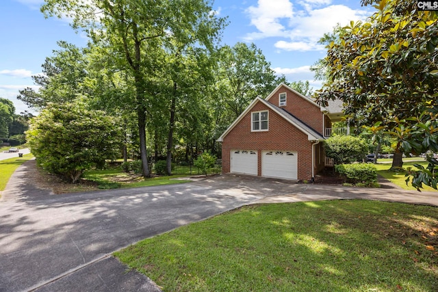 101 Stephenson Ln, Columbia, SC 29212 - view of side of home with driveway, brick siding, a garage, and a yard