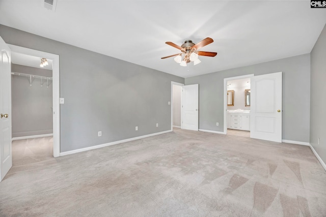 101 Stephenson Ln, Columbia, SC 29212 - unfurnished bedroom with baseboards, carpet flooring, a walk in closet, and ensuite bathroom