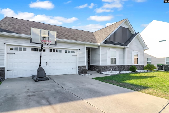 542 Pineberry Ct, West Columbia, SC 29170 - view of front of home with board and batten siding, stone siding, driveway, a garage, and a front yard