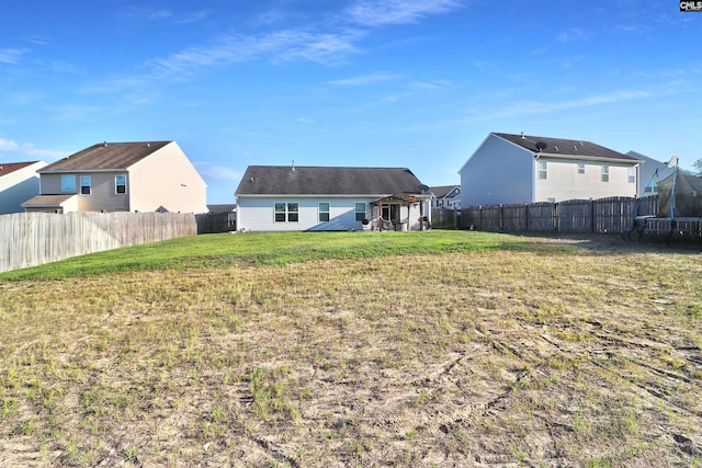 542 Pineberry Ct, West Columbia, SC 29170 - rear view of property with a trampoline