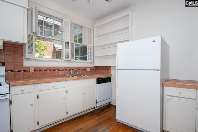 111 Southwood Dr, Columbia, SC 29205 - kitchen with white appliances, a sink, white cabinetry, and decorative backsplash