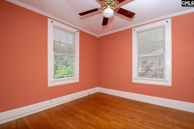 111 Southwood Dr, Columbia, SC 29205 - spare room with wood finished floors, baseboards, ceiling fan, and crown molding