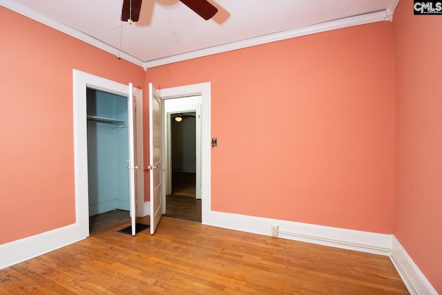 111 Southwood Dr, Columbia, SC 29205 - unfurnished bedroom featuring light wood-style flooring, ornamental molding, baseboards, a ceiling fan, and a closet