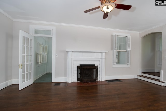 111 Southwood Dr, Columbia, SC 29205 - unfurnished living room with wood finished floors, crown molding, arched walkways, a ceiling fan, and a fireplace