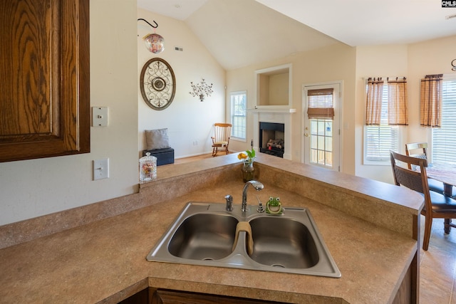 6126 Slab Landing Dr, Cope, SC 29038 - kitchen with a sink, open floor plan, a fireplace, lofted ceiling, and a peninsula