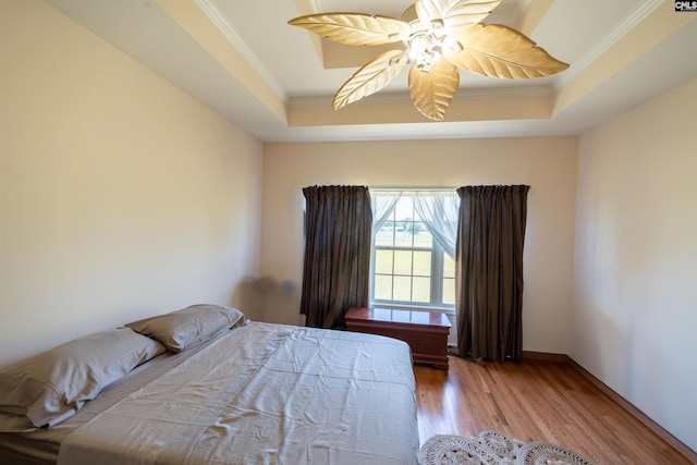 6126 Slab Landing Dr, Cope, SC 29038 - bedroom featuring ornamental molding, a raised ceiling, wood finished floors, and a ceiling fan
