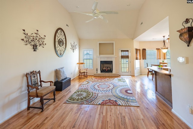 6126 Slab Landing Dr, Cope, SC 29038 - living room with high vaulted ceiling, wood finished floors, baseboards, ceiling fan, and a fireplace