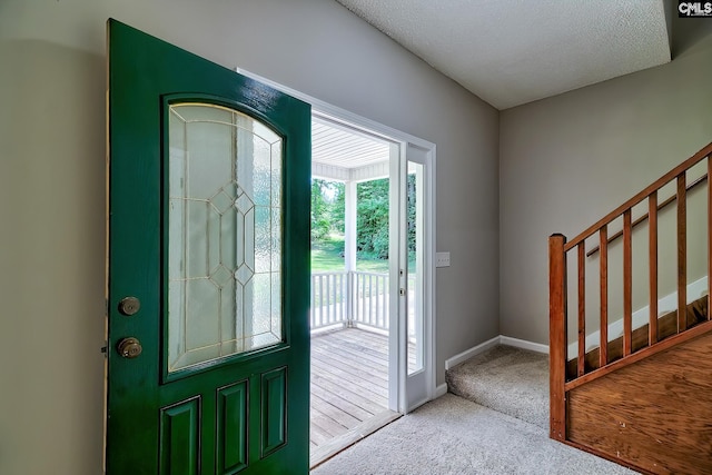 198 Beaver Creek Cir, Lugoff, SC 29078 - foyer entrance with carpet, baseboards, stairway, and a textured ceiling