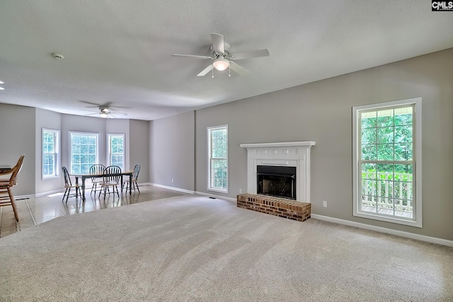 198 Beaver Creek Cir, Lugoff, SC 29078 - living area featuring a ceiling fan, baseboards, a fireplace, and carpet