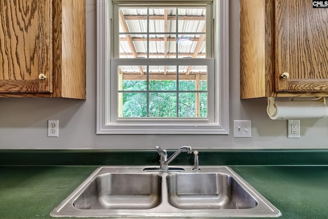 198 Beaver Creek Cir, Lugoff, SC 29078 - kitchen featuring a sink, dark countertops, and brown cabinetry
