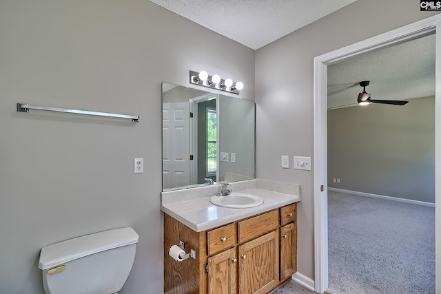 198 Beaver Creek Cir, Lugoff, SC 29078 - bathroom featuring vanity, a ceiling fan, toilet, a textured ceiling, and baseboards