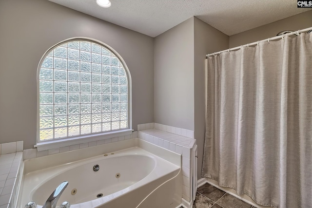 198 Beaver Creek Cir, Lugoff, SC 29078 - bathroom with a jetted tub, a textured ceiling, and a shower with curtain