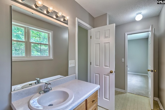198 Beaver Creek Cir, Lugoff, SC 29078 - bathroom with vanity, baseboards, tile patterned flooring, and a textured ceiling