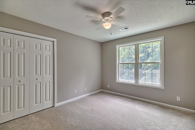 198 Beaver Creek Cir, Lugoff, SC 29078 - unfurnished bedroom with carpet flooring, baseboards, a closet, and a textured ceiling