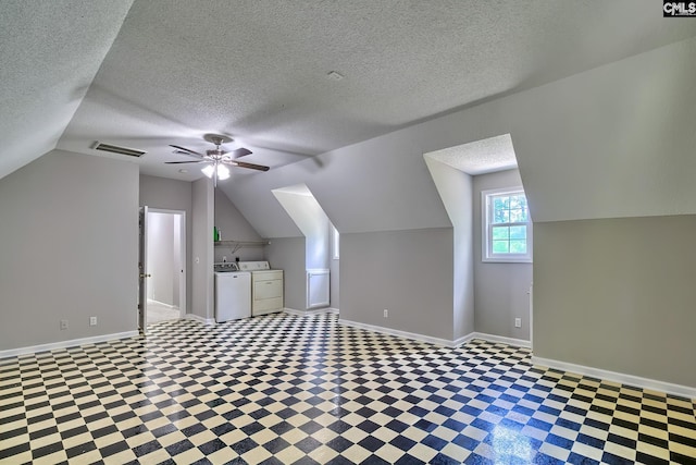198 Beaver Creek Cir, Lugoff, SC 29078 - bonus room featuring washer and dryer, baseboards, lofted ceiling, a textured ceiling, and ceiling fan