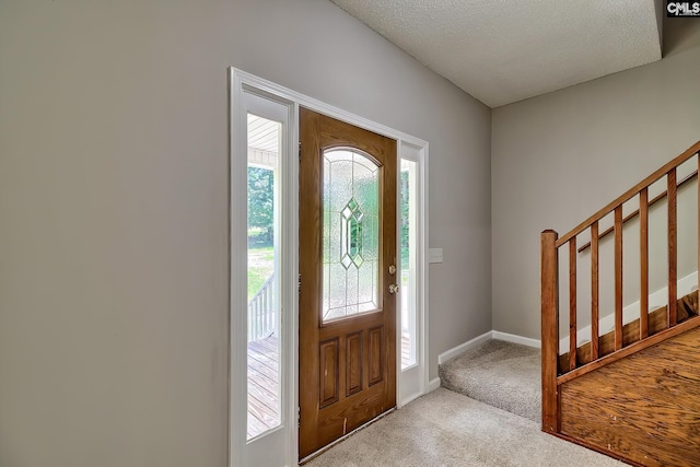 198 Beaver Creek Cir, Lugoff, SC 29078 - entrance foyer featuring carpet flooring, stairs, baseboards, and a textured ceiling