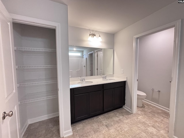 184 Windfall Rd, Blythewood, SC 29016 - bathroom with double vanity, baseboards, and toilet