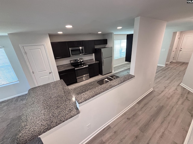 184 Windfall Rd, Blythewood, SC 29016 - kitchen with stainless steel appliances, dark cabinets, a sink, baseboards, and recessed lighting