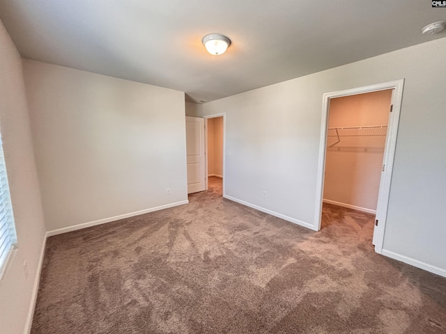 184 Windfall Rd, Blythewood, SC 29016 - unfurnished bedroom with carpet, a walk in closet, and baseboards
