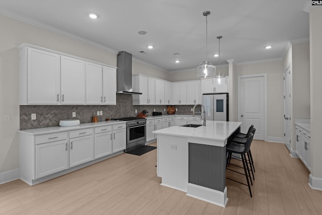 204 Peninsula Way, Columbia, SC 29229 - kitchen featuring wall chimney range hood, appliances with stainless steel finishes, a sink, white cabinets, and crown molding