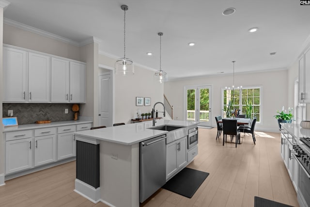 204 Peninsula Way, Columbia, SC 29229 - kitchen with stainless steel appliances, a sink, light wood finished floors, light countertops, and decorative backsplash