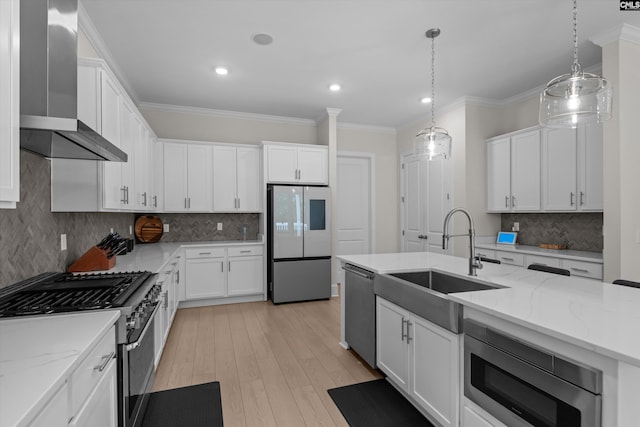 204 Peninsula Way, Columbia, SC 29229 - kitchen featuring appliances with stainless steel finishes, wall chimney range hood, a sink, white cabinetry, and crown molding