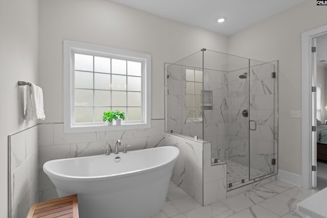 204 Peninsula Way, Columbia, SC 29229 - ensuite bathroom with a soaking tub, a marble finish shower, plenty of natural light, marble finish flooring, and wainscoting
