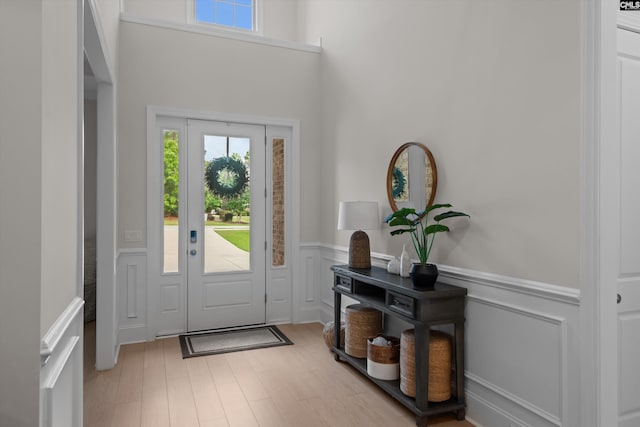 204 Peninsula Way, Columbia, SC 29229 - foyer entrance featuring plenty of natural light, a wainscoted wall, a decorative wall, and light wood finished floors