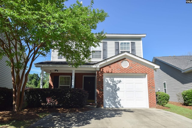 267 Courtside Dr, Lexington, SC 29073 - traditional home with concrete driveway, brick siding, a garage, and covered porch