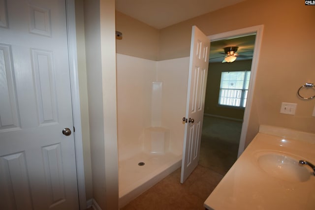 267 Courtside Dr, Lexington, SC 29073 - bathroom with a stall shower, a ceiling fan, vanity, and tile patterned flooring