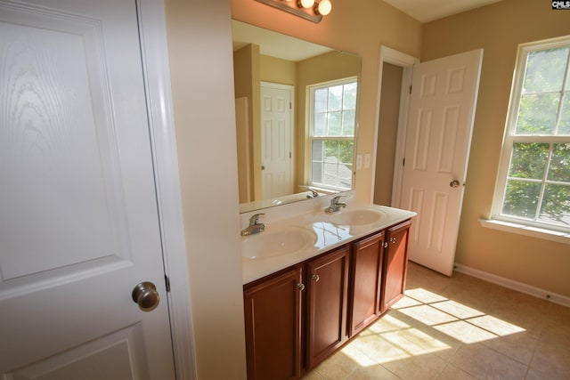 267 Courtside Dr, Lexington, SC 29073 - bathroom featuring double vanity, healthy amount of natural light, baseboards, and tile patterned floors